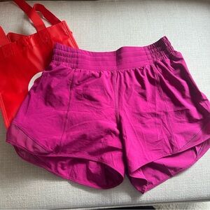NWOT Lululemon Bright Magenta Hotty Hot Shorts Size 6 With Lululemon bag